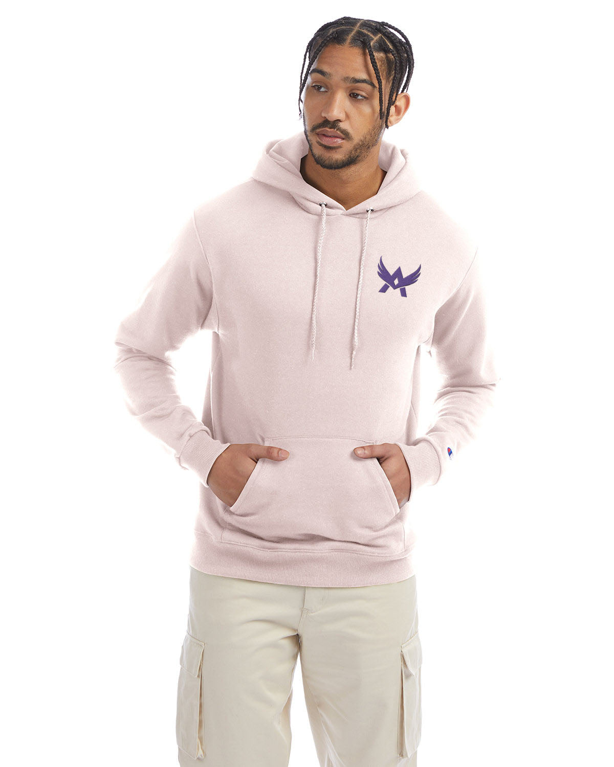 Model wearing a body blush Champion hoodie with a front kangaroo pocket and a purple abstract winged logo on the left chest