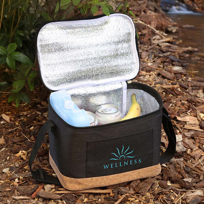 Top-angle view of open black insulated cooler bag with cork bottom, showing reflective lining