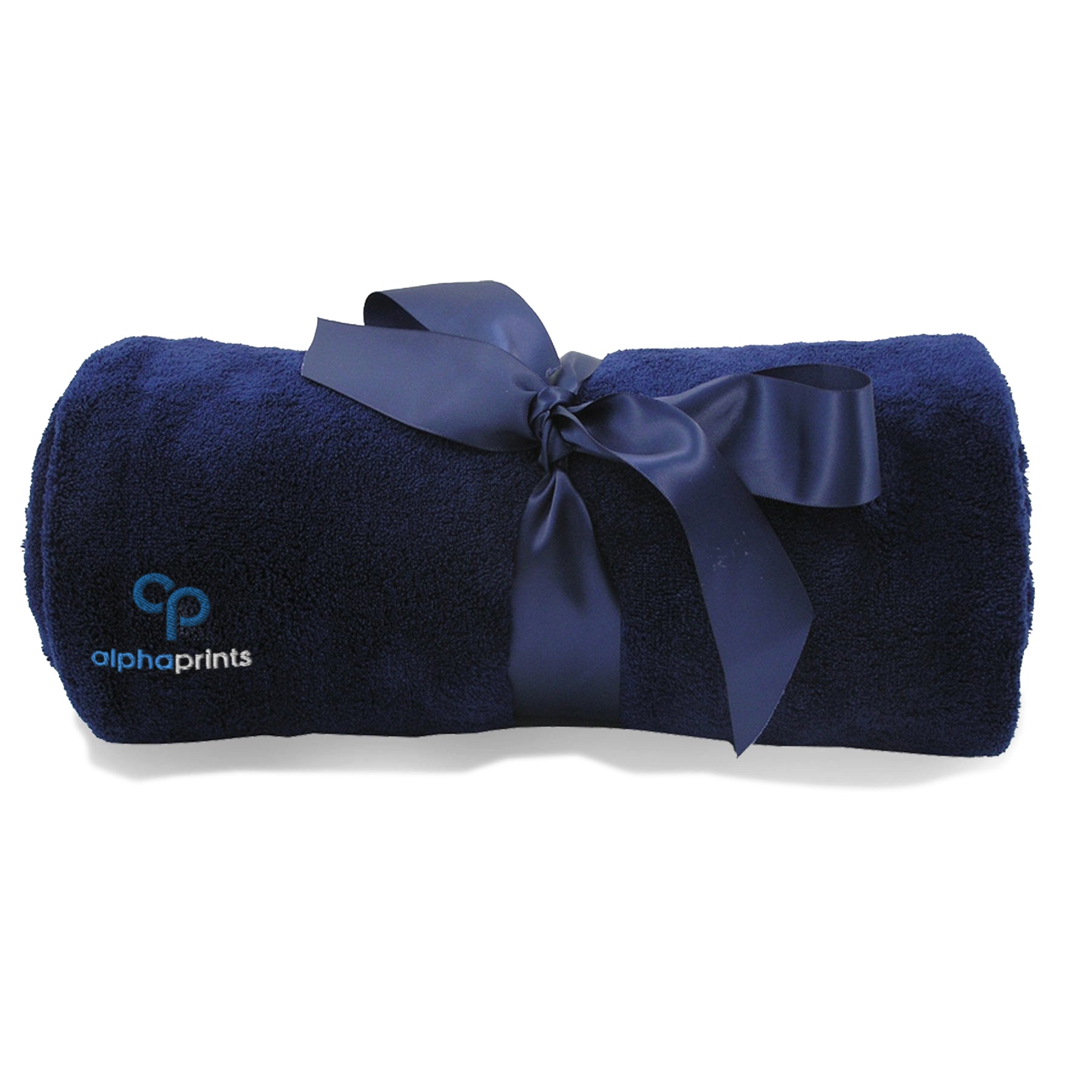 Rolled cabalt blue plush blanket tied with a satin ribbon and embroidered with the 'alphaprints' logo.