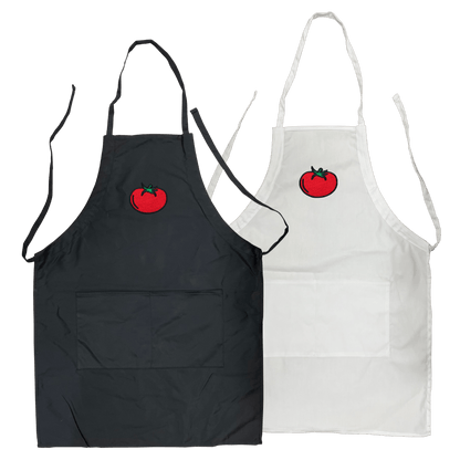 Black and white polyester-cotton aprons, each with front pockets and an embroidered red tomato logo on the chest area.