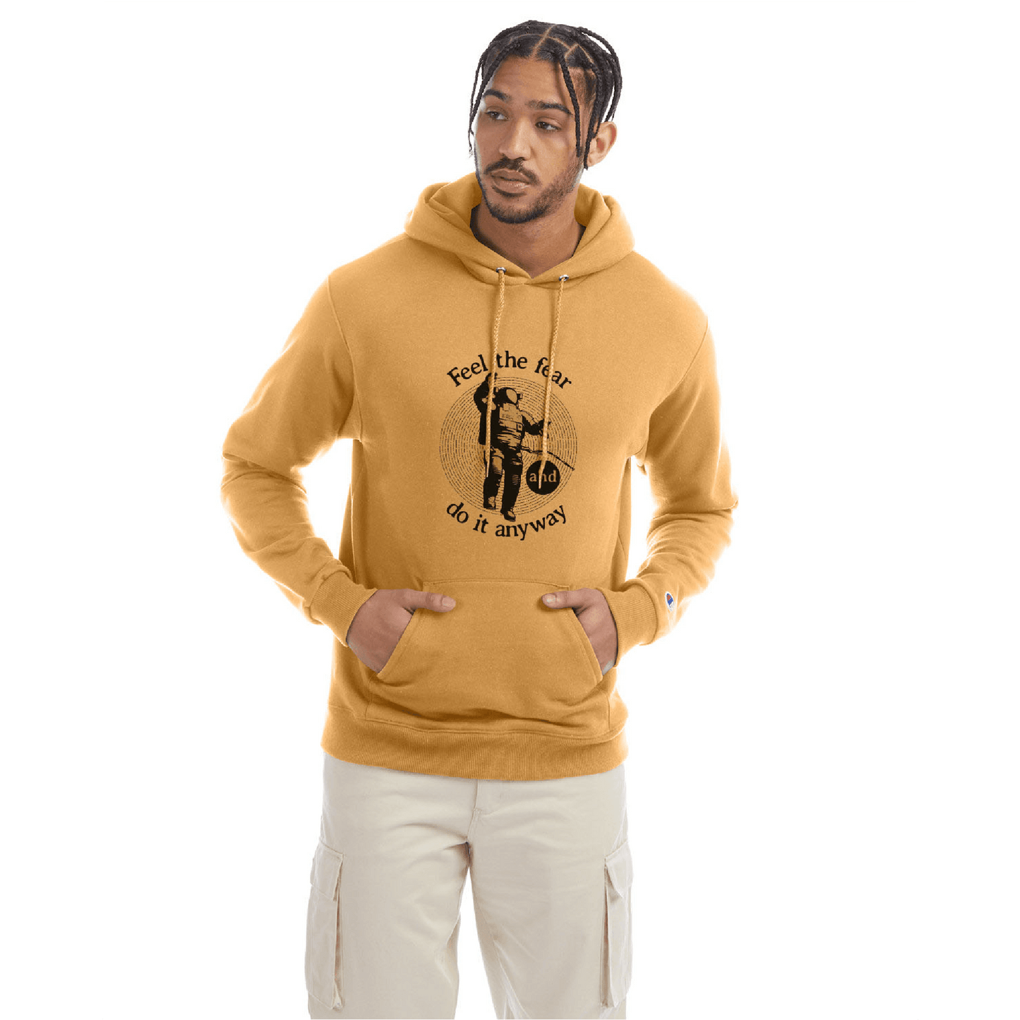 Golden brown Champion hoodie with a front graphic and the quote “Feel the fear and do it anyway