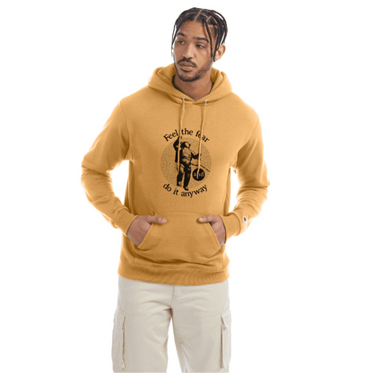 Golden brown Champion hoodie with a front graphic and the quote “Feel the fear and do it anyway