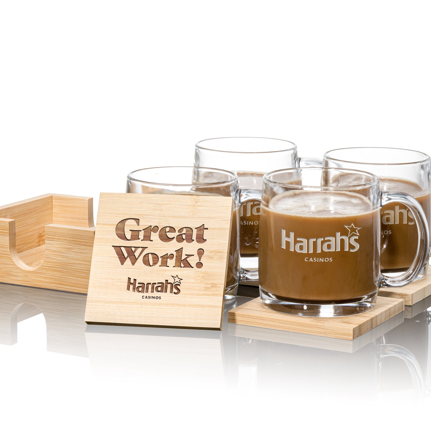 Set of four clear glass mugs with "Harrah's Casinos" logo, placed on square wooden coasters
