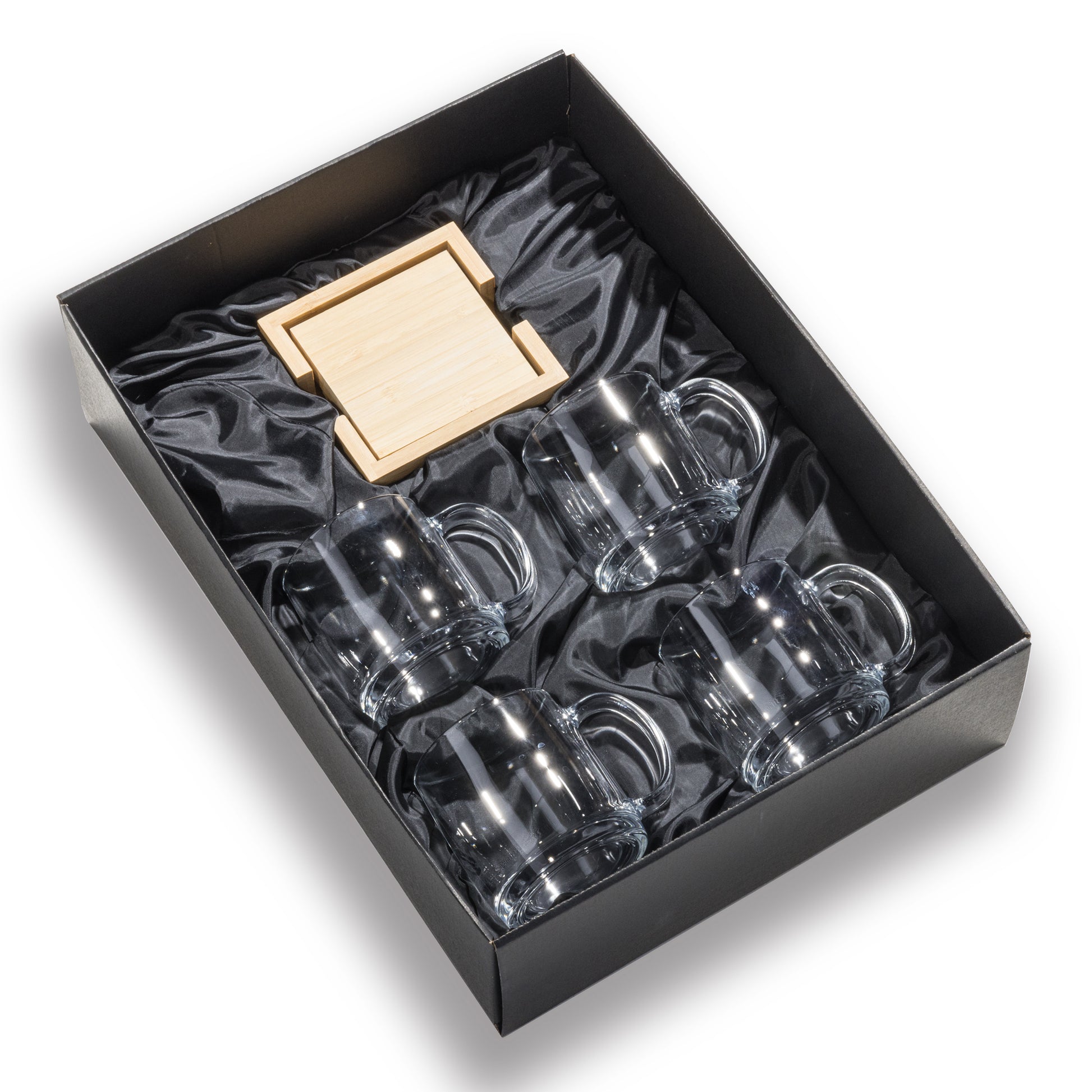 Gift set with four clear glass mugs and wooden coasters in a black silk-lined box.
