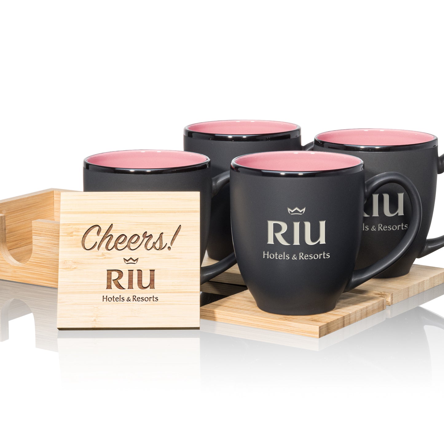 Matte black mugs with pink interiors, paired with engraved wooden coasters in a stylish gift set.
