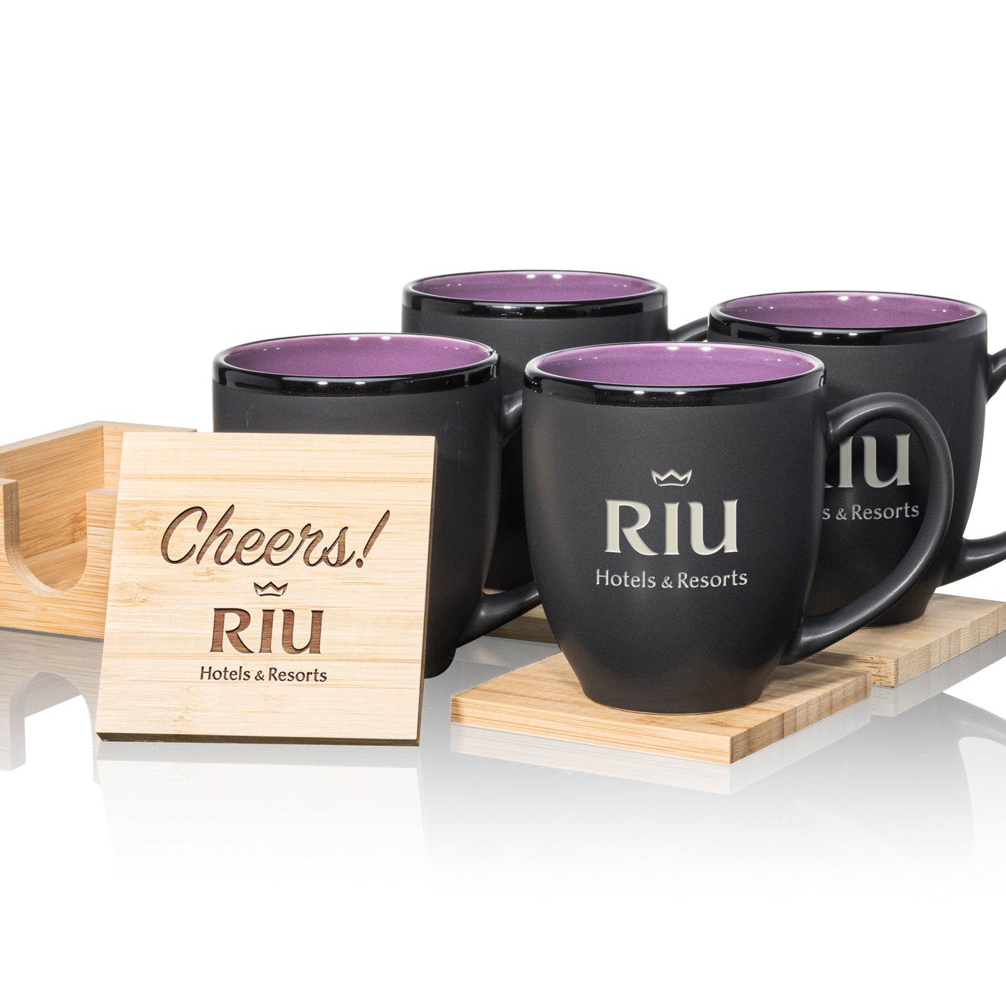 Matte black mugs with purple interiors, paired with engraved wooden coasters in a stylish gift set.