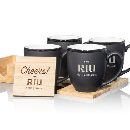 Matte black mugs with white interiors, paired with engraved wooden coasters in a stylish gift set.