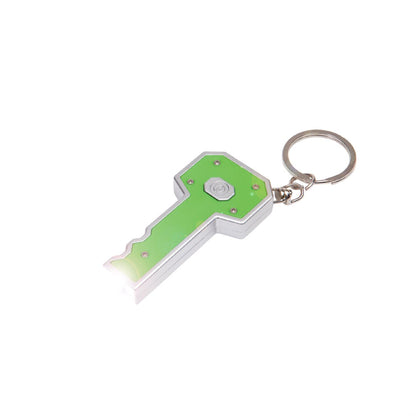 Back view of the Key LED Flashlight keychain in silver and green, showing the LED light in use and centered activation button with metal keyring attachment.