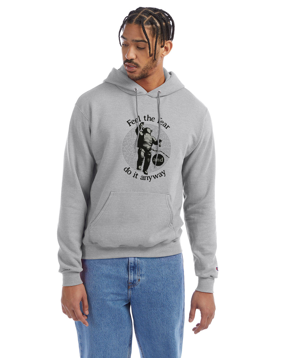 Light steel Champion hoodie with “Feel the fear and do it anyway” graphic, worn with blue jeans.