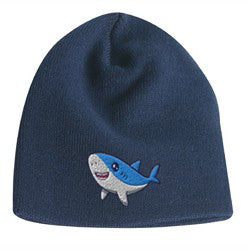 Navy blue acrylic knit beanie featuring a cute embroidered cartoon shark logo on the front.