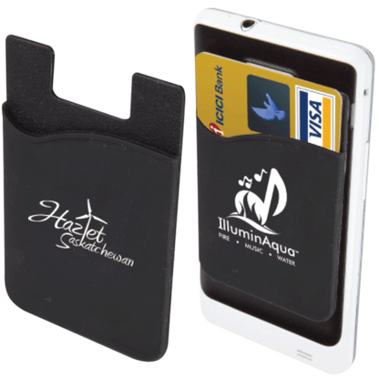 Two black silicone phone wallets with white printed logos — one displaying "Hazlet Saskatchewan" and the other attached to a phone holding two credit cards, featuring the "IlluminAqua" logo 