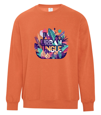 Orange crewneck sweatshirt with a bold 'Urban Jungle' graphic design on the chest, featuring colorful tropical leaves, abstract buildings, and geometric shapes