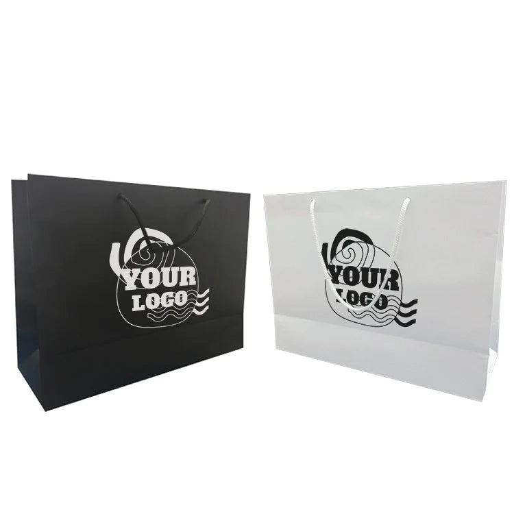 Black and white custom paper shopping bags with rope handles and a wavy circular "YOUR LOGO" design on the front