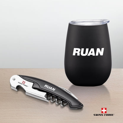 Swiss Force® Rosette Wine Gift Set with a matte black wine tumbler featuring a white 'RUAN' logo and a matching corkscrew bottle opener with engraved branding, displayed on a light wooden surface.