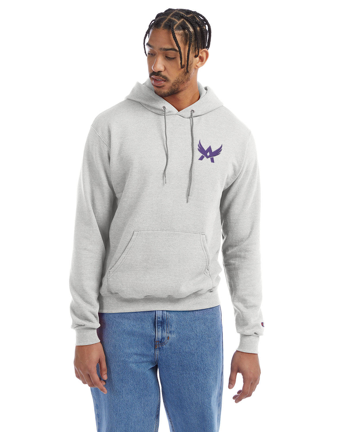 Model wearing a silver grey Champion hoodie with a front kangaroo pocket and a purple abstract winged logo on the left chest
