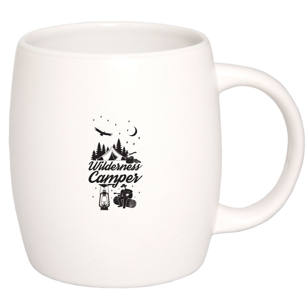 White ceramic mug with "Wilderness Camper" design featuring trees, tent, and camping icons.