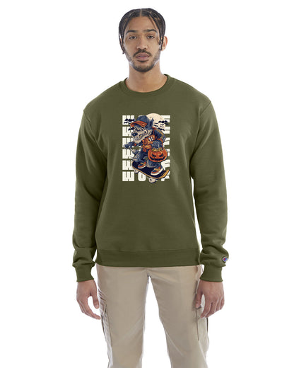 Fresh olive crewneck sweatshirt with a Halloween-themed graphic of a cartoon werewolf skateboarding with a pumpkin basket, worn by a model in beige pants.