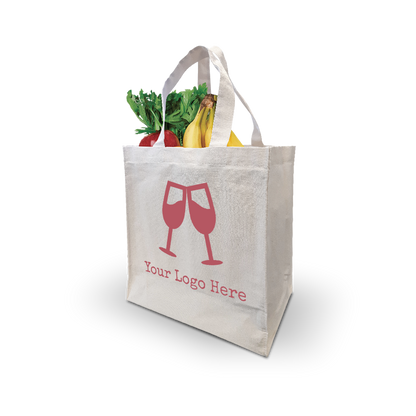 Natural canvas grocery tote with custom wine glass logo, shown carrying fresh produce.