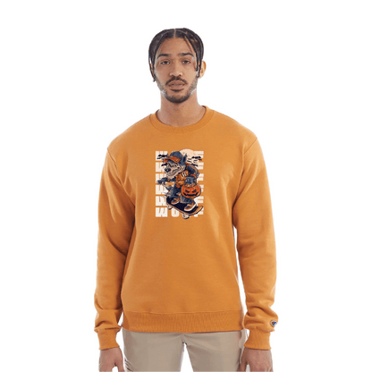 Golden yellow crewneck sweatshirt with a Halloween-themed graphic of a cartoon werewolf skateboarding with a pumpkin basket, worn by a model in beige pants.