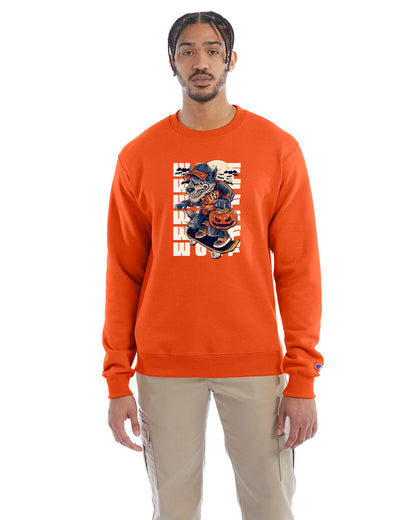 Orange crewneck sweatshirt with a Halloween-themed graphic of a cartoon werewolf skateboarding with a pumpkin basket, worn by a model in beige pants.
