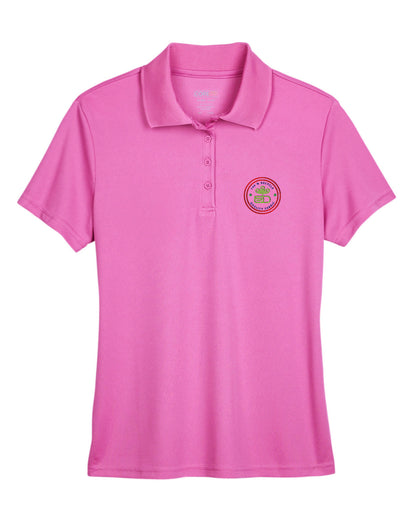 Charity pink Core365 Ladies' Origin Performance Piqué Polo with short sleeves, a four-button placket, and a circular embroidered logo on the left chest.