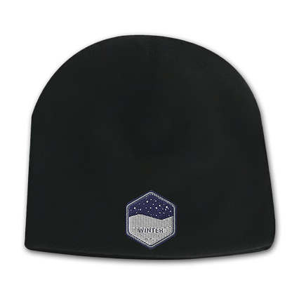 Black deluxe fleece beanie with a hexagon-shaped embroidered patch featuring a snowy night design on the front.
