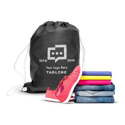 Black drawstring backpack with custom logo print, displayed alongside folded clothes and sneakers.