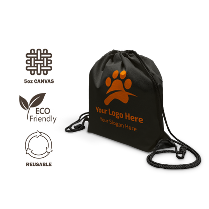 Black drawstring backpack made from 6oz canvas, featuring an orange paw print logo placeholder with the text “Your Logo Here” and “Your Slogan Here.” Eco-friendly and reusable icons displayed on the left.