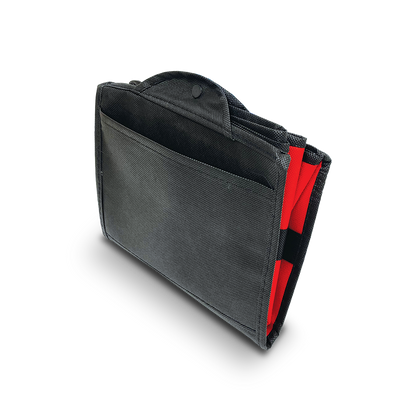 Folded view of a reusable shopping tote in black and red with a snap closure.