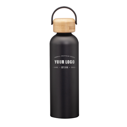 Matte black stainless steel water bottle with bamboo lid and handle, featuring engraved custom logo on front.