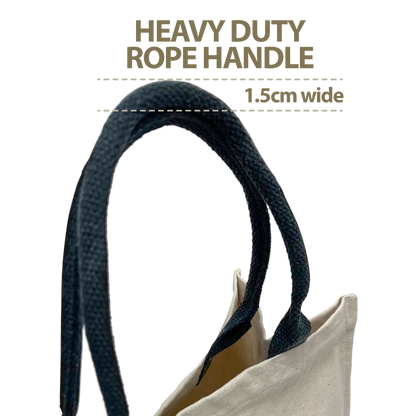 Close-up view of a 1.5cm wide heavy-duty black rope handle attached to a beige canvas tote bag, showcasing its thick, durable construction.
