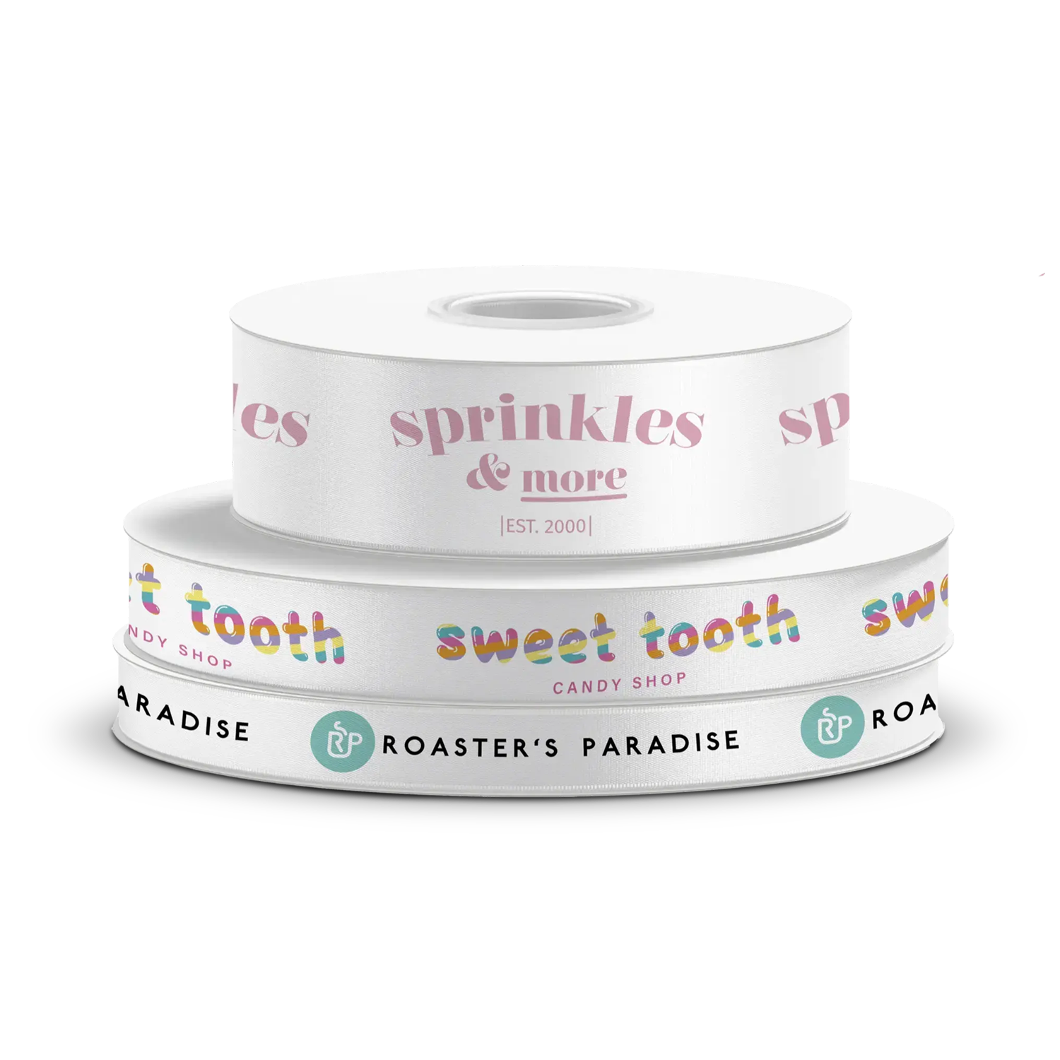 Stack of three custom white ribbon spools featuring various brand designs 