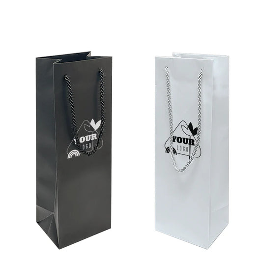 Black and white matte laminated paper wine bags with rope handles, each designed to hold a single bottle and featuring a customizable logo on the front.