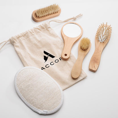 Natural relaxation spa kit with custom cotton drawstring bag, featuring wooden-handled mirror, brushes, comb, and loofah pad.