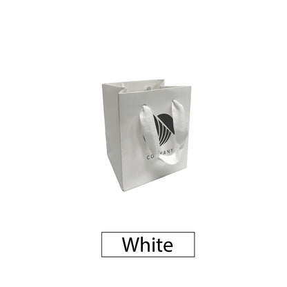 White square gift bag with short white ribbon handles and a centered company logo.