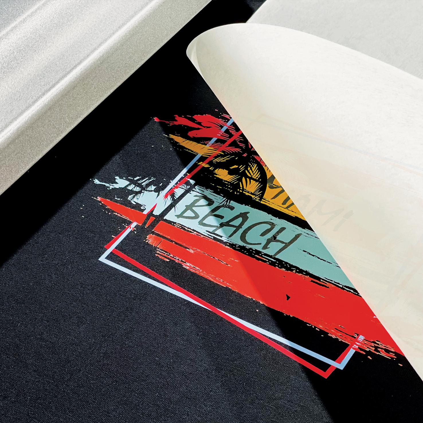 A close-up of a Miami Beach-themed Custom DTF Heat Transfer Sheet being peeled off fabric